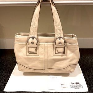 COACH sand colored pebble leather shoulder bag.